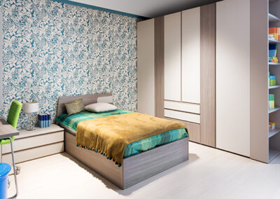 floral dramatic accent wall wallpaper installation in bedroom