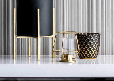 graphic black and white pinstripe wallpaper installation on accent wall in foyer