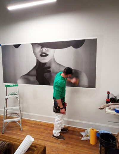 wallpaper hanger installing large feature wall