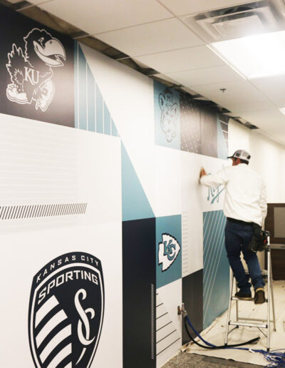 corporate feature wall sports-themed wallpaper installation